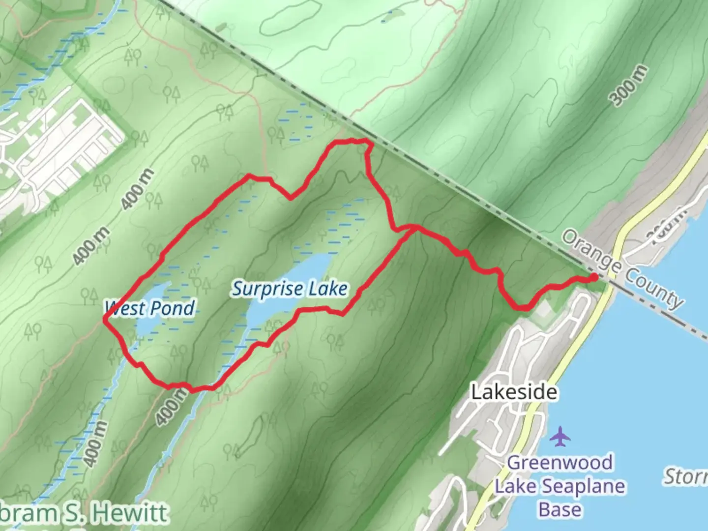 An image depicting the trail Surprise Lake and West Pond Loop via State LIne Trail and its surrounding area.