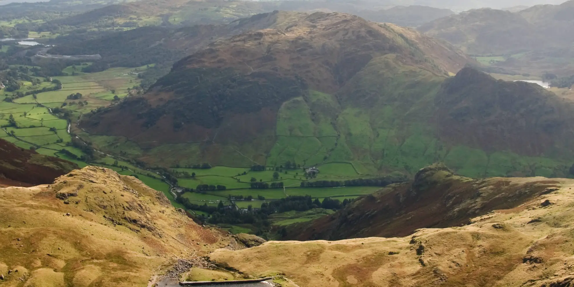 An image depicting the trail Walk the Langdale Pikes via Jack’s Rake and its surrounding area.