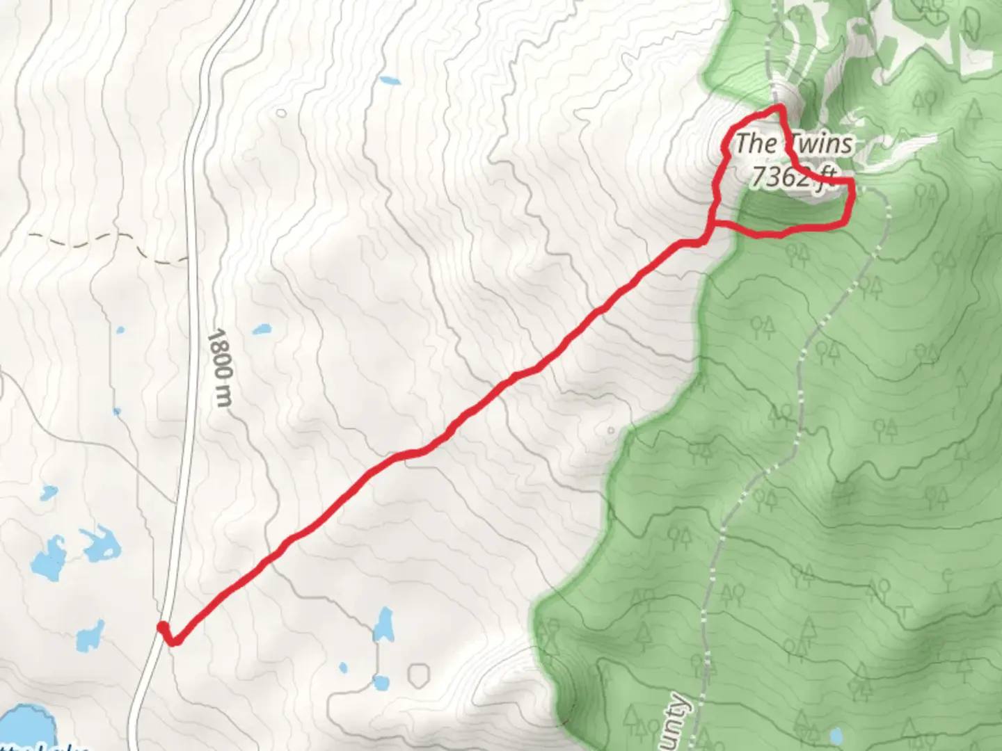 An image depicting the trail The Twins via Twin Peaks Trail and its surrounding area.