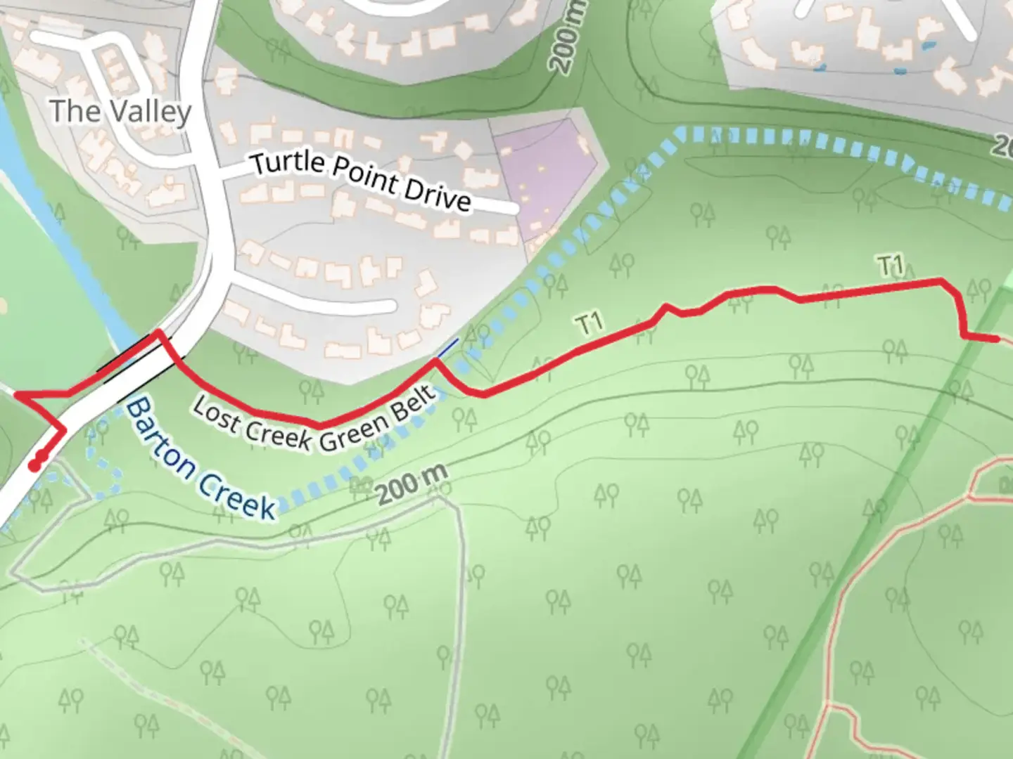 An image depicting the trail Lost Creek Green Belt and its surrounding area.