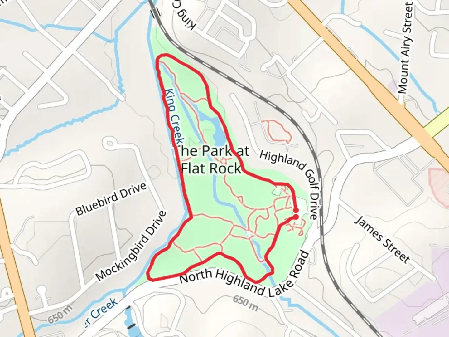 An image depicting the trail The Park at Flat Rock Loop and its surrounding area.