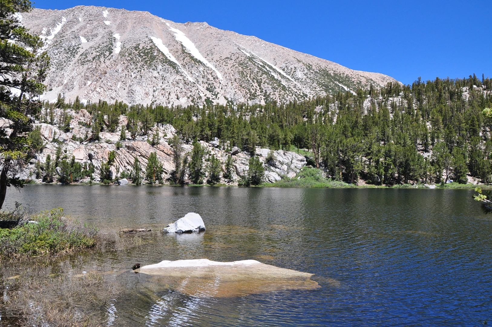 An image depicting the trail Sixth Lake and Black Lake via North Fork Big Pine Creek Trail and its surrounding area.