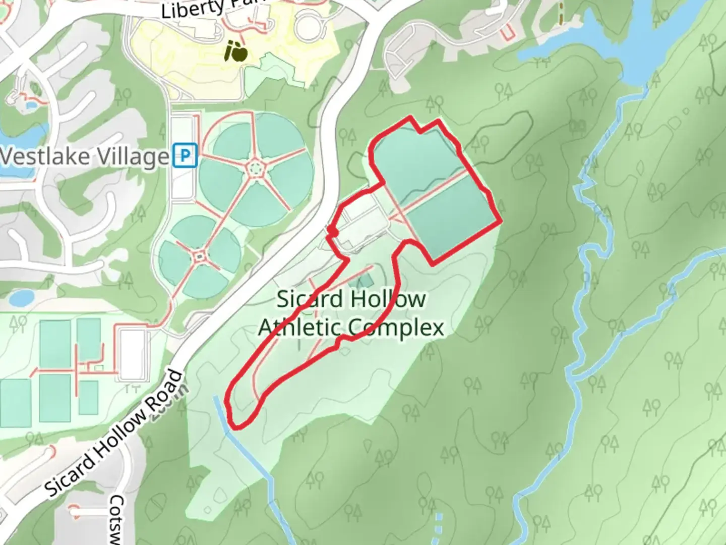 An image depicting the trail Sicard Hollow Athletic Loop and its surrounding area.