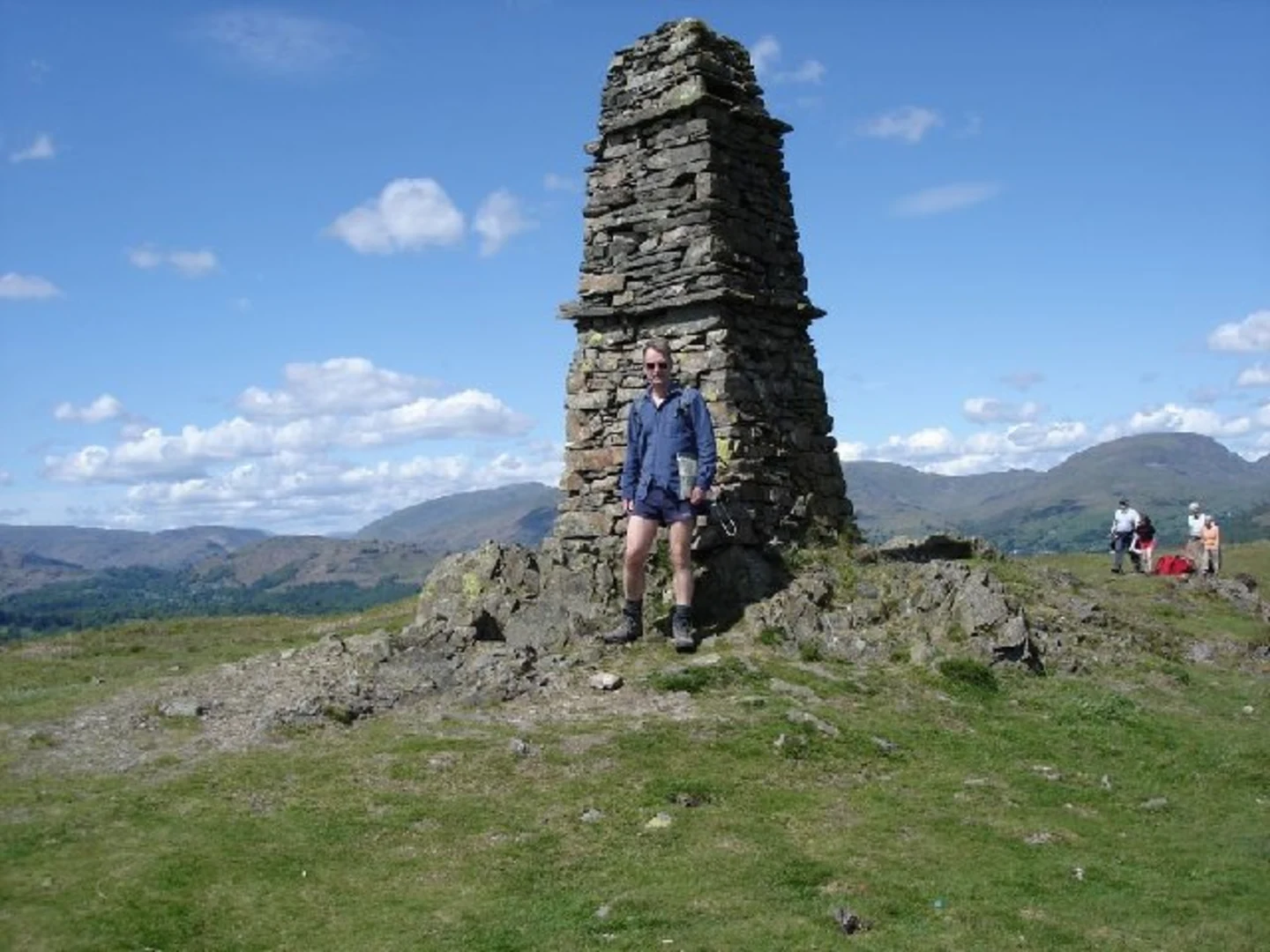 An image depicting the trail High Wray Loop via Blelham Tarn and Wray Castle and its surrounding area.