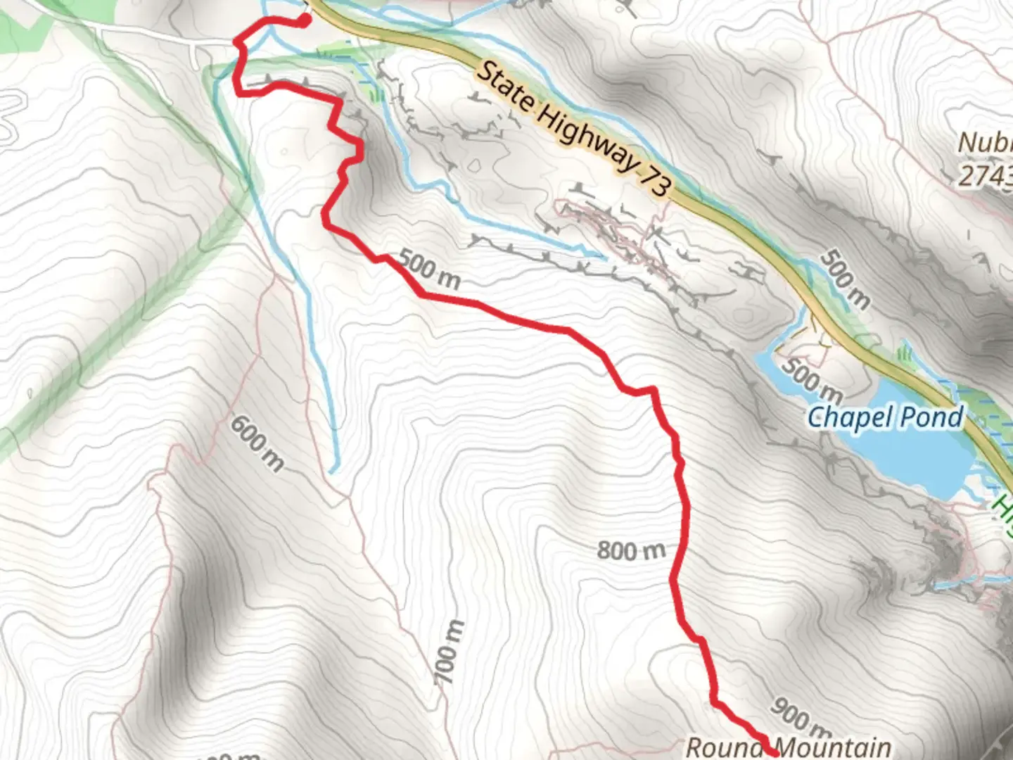 An image depicting the trail Round Mountain and its surrounding area.