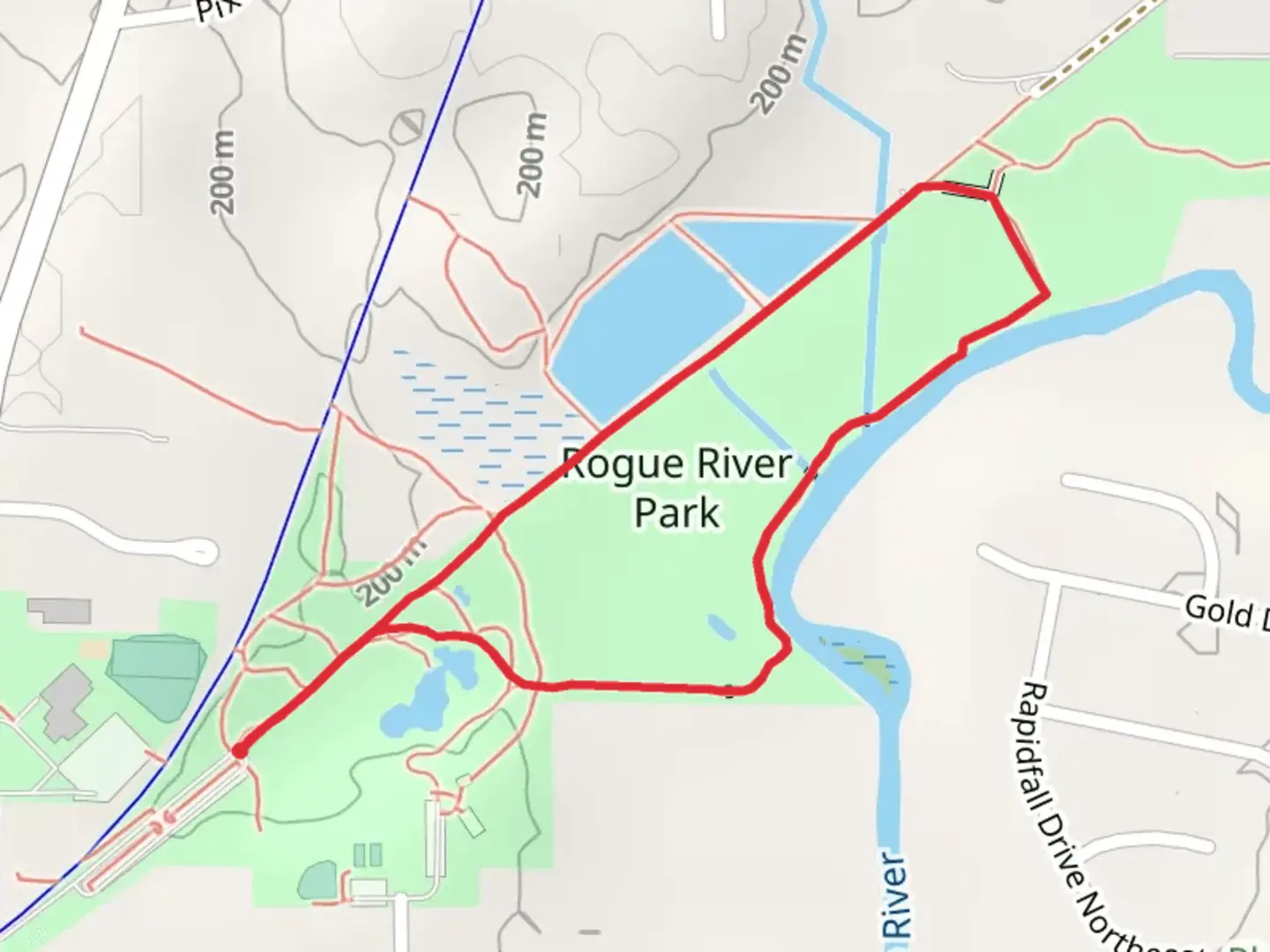 An image depicting the trail Rogue River Park Loop and its surrounding area.