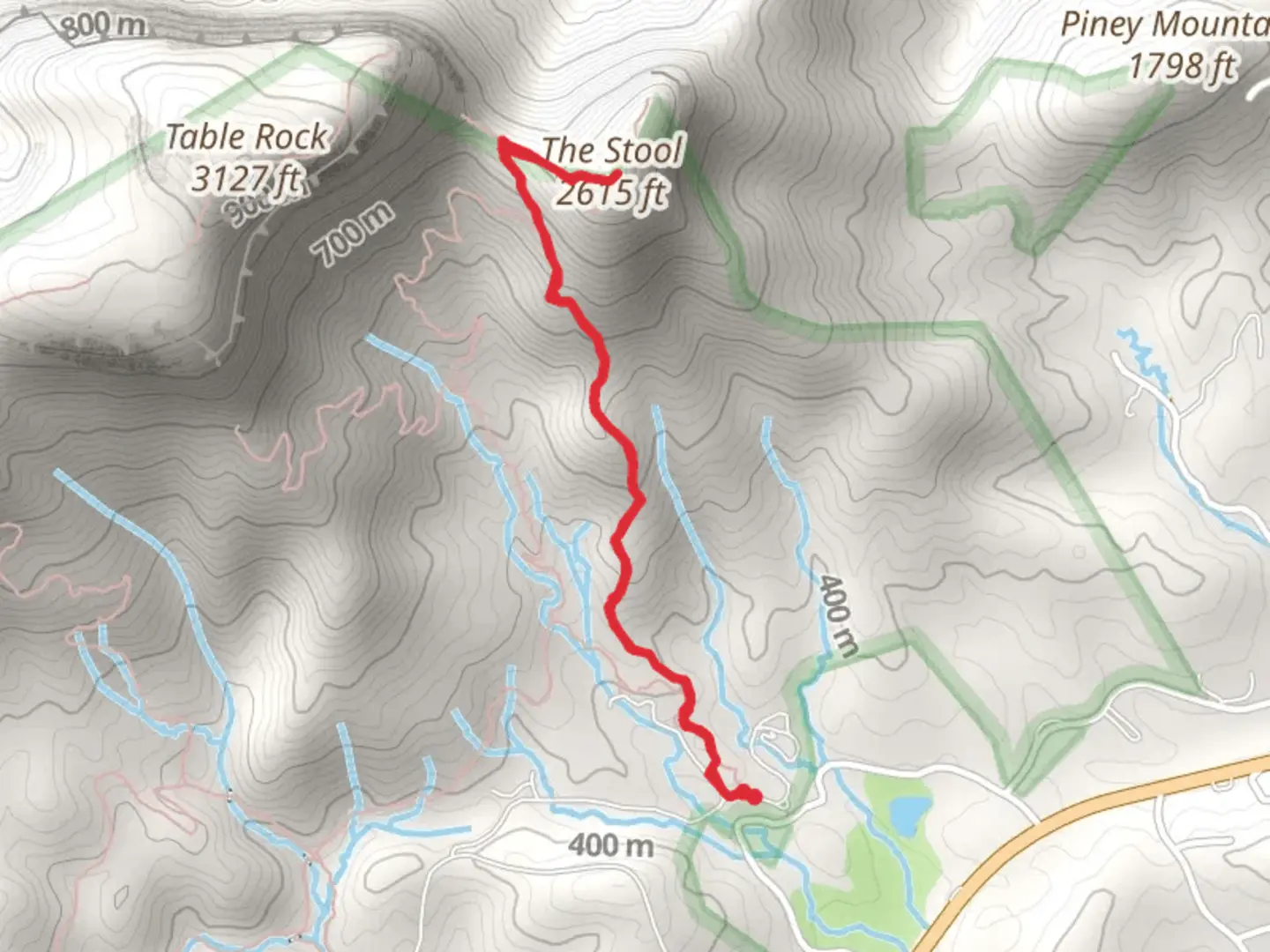 An image depicting the trail The Stool via Carolina Climbers Coalition Trail and its surrounding area.
