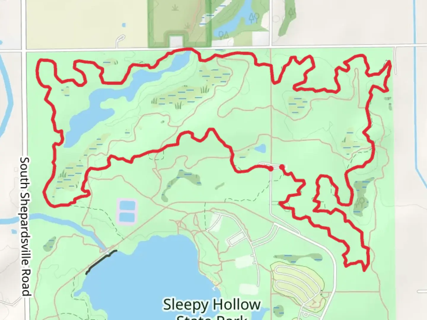 An image depicting the trail Sleepy Hollow State Park North Loop and its surrounding area.