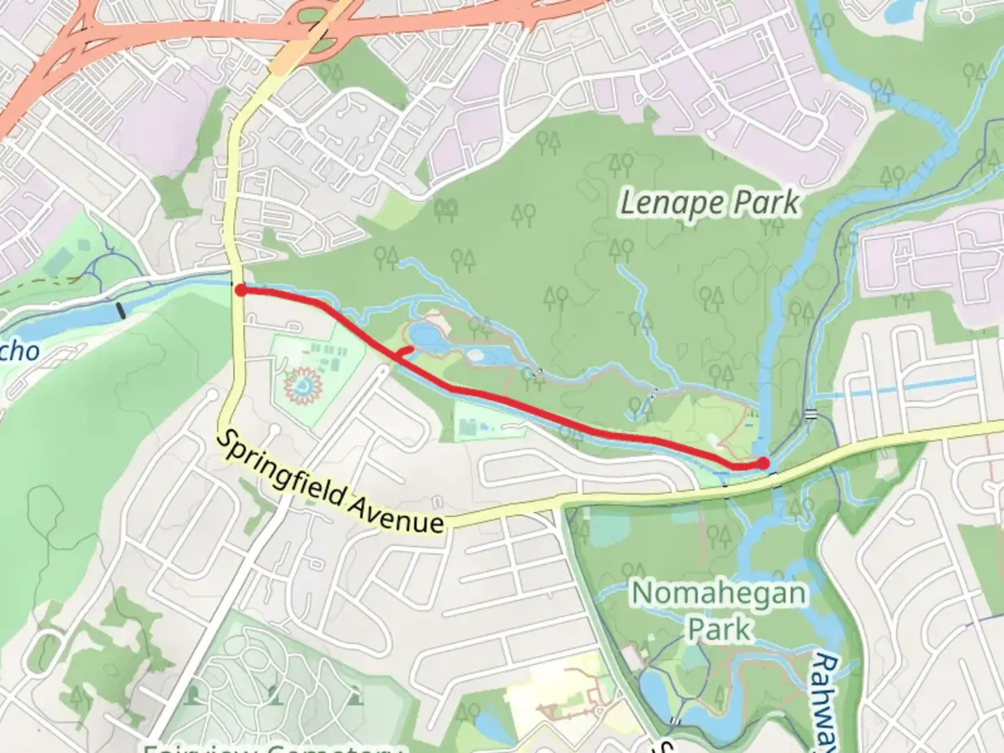 An image depicting the trail Lenape Park Pond and its surrounding area.