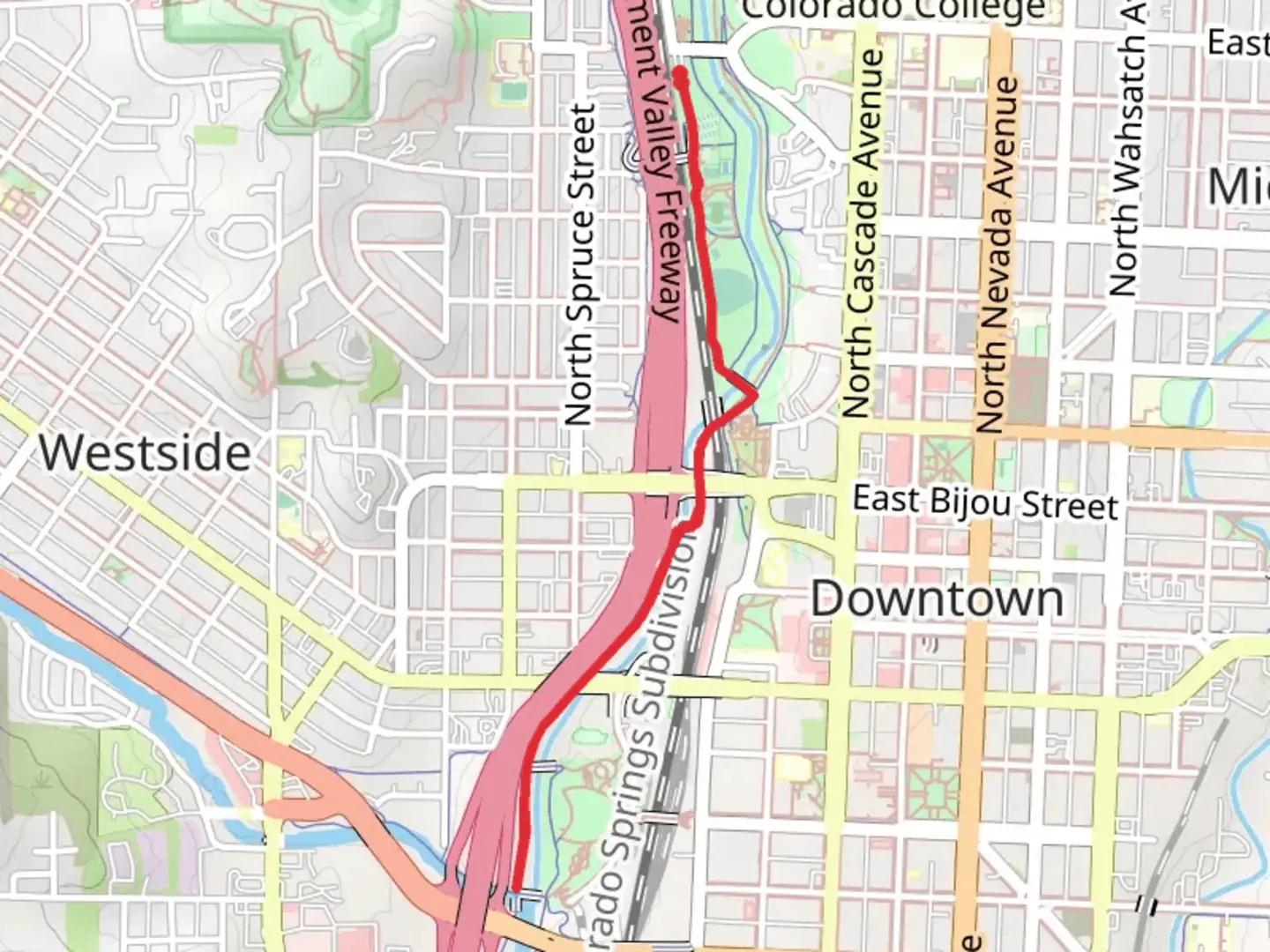 An image depicting the trail Pikes Peak Greenway and its surrounding area.