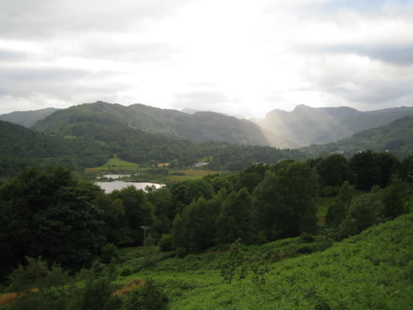 An image depicting the trail Elterwater to Skelwith Bridge Walk via Cumbria Way and its surrounding area.