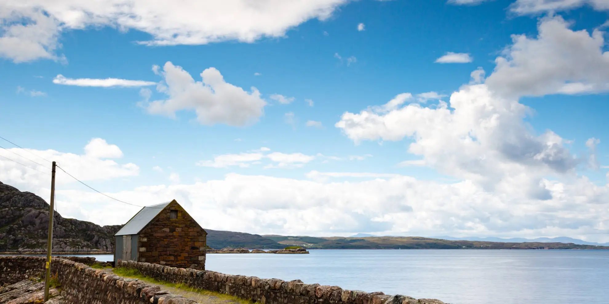 An image depicting the trail Diabaig to Red Point Beach Walk and its surrounding area.