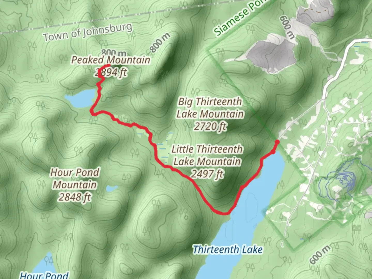An image depicting the trail Peaked Mountain and Pond Trail and its surrounding area.
