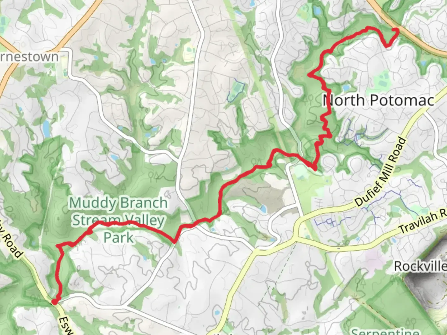 An image depicting the trail Muddy Branch Greenway Trail and its surrounding area.