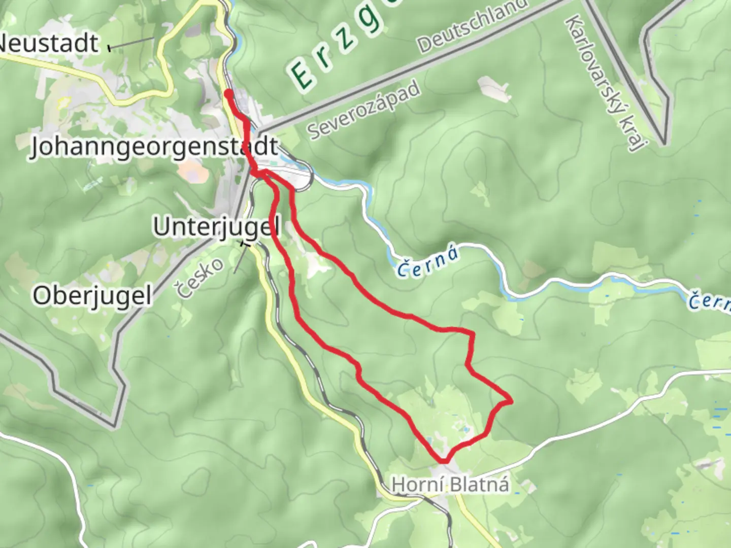 An image depicting the trail Blatenský vrch Loop from Potůčky and its surrounding area.