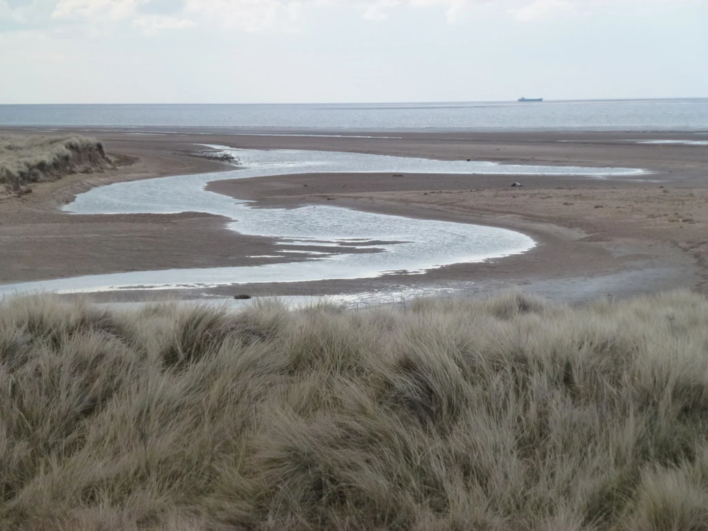 An image depicting the trail Sedgeford to Thornham Walk via West Sands and its surrounding area.