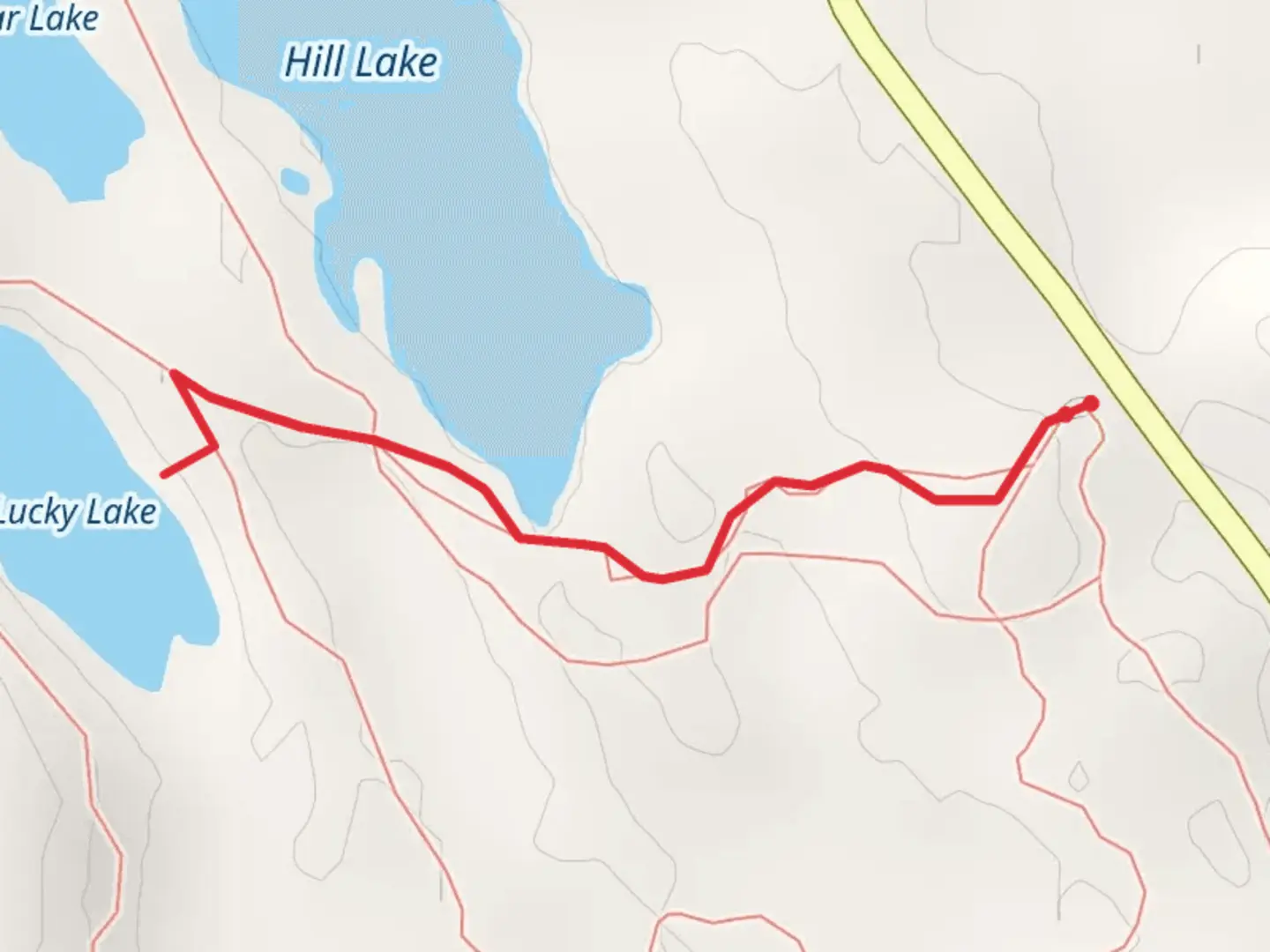 An image depicting the trail Lucky Lake and its surrounding area.