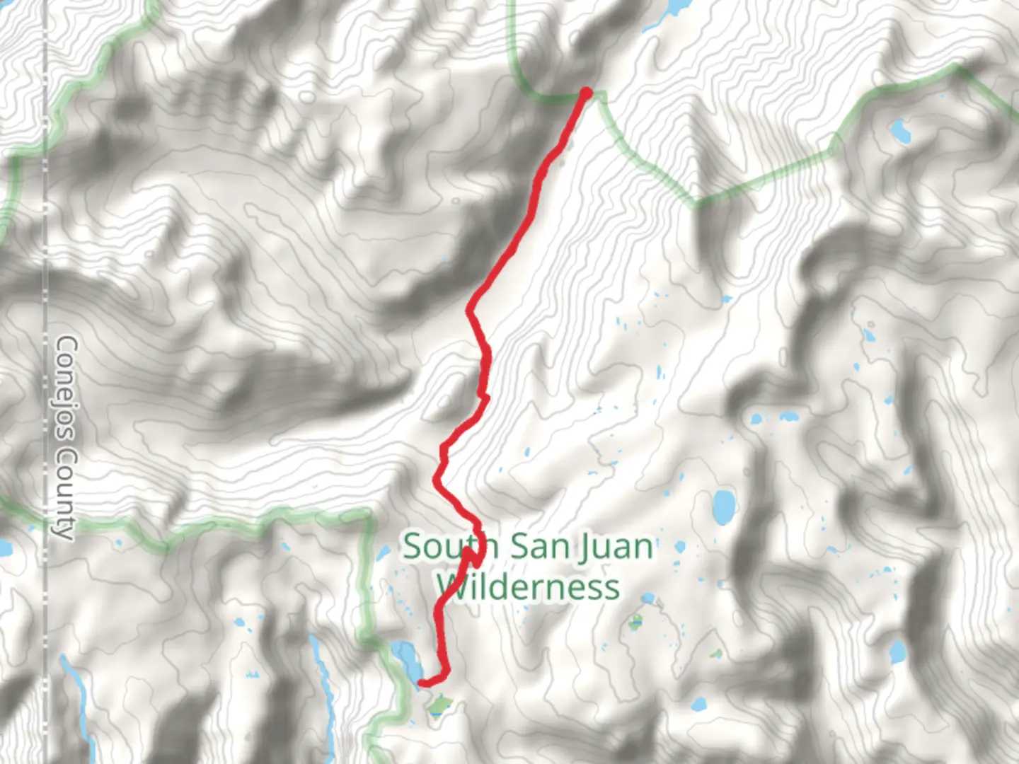 An image depicting the trail Blue Lake via Conejos River Trail and its surrounding area.