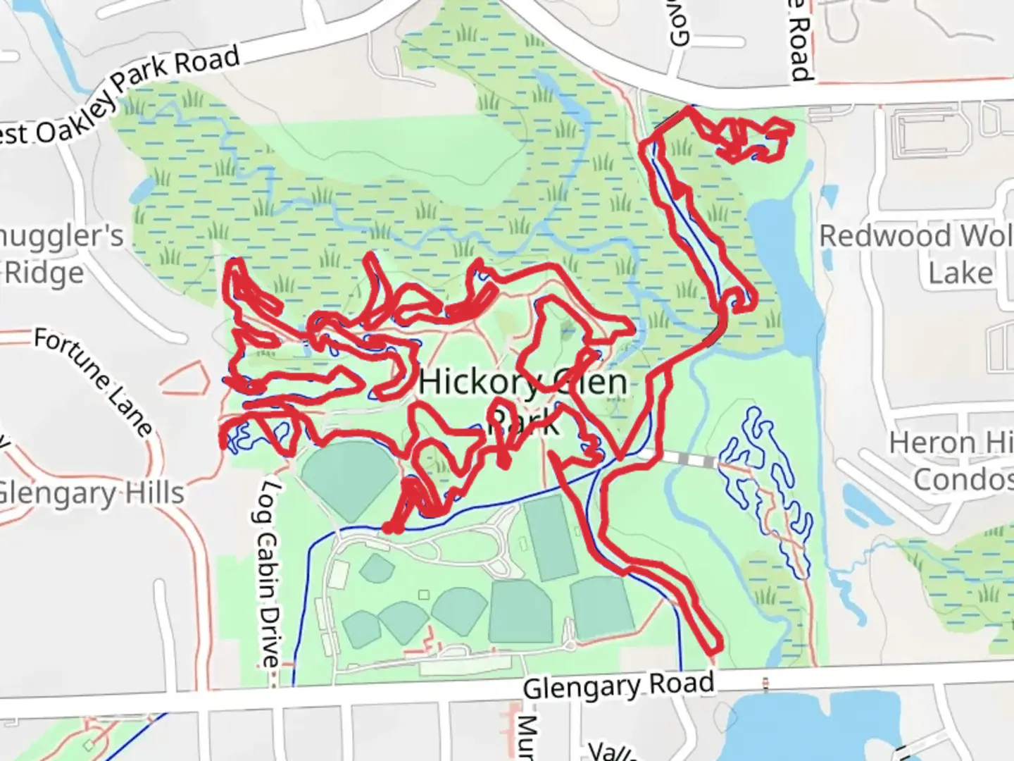 An image depicting the trail Log Cabin, Red House and Lakes Community Trail in Hickory Glen Park Loop and its surrounding area.