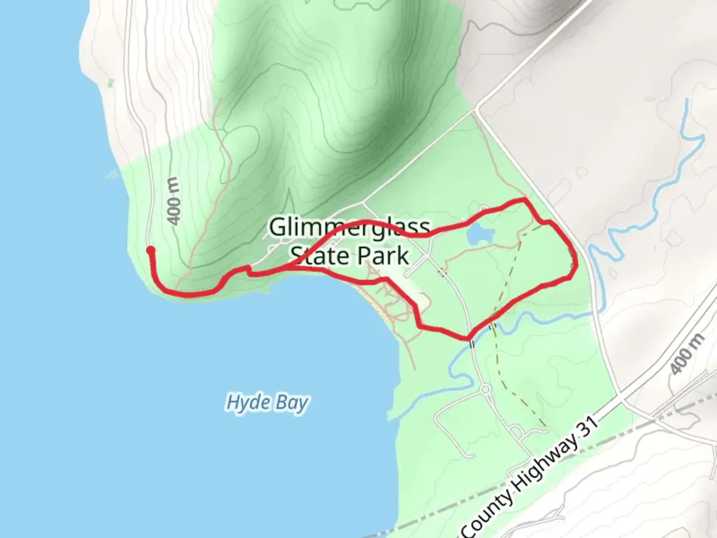 An image depicting the trail Glimmerglass State Park Loop Trail and its surrounding area.
